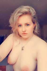 buxomy girls in passionate embrace, groping each others massive bra-stuffers
