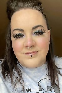 sensuous plus-size dolls share affectionate embrace